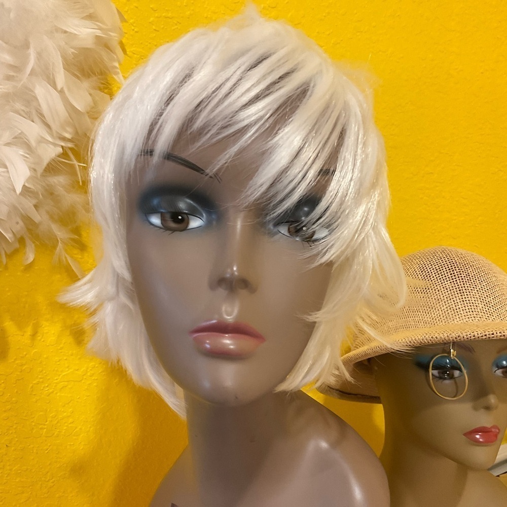 Worn on mannequin heads only.  Synthetic.